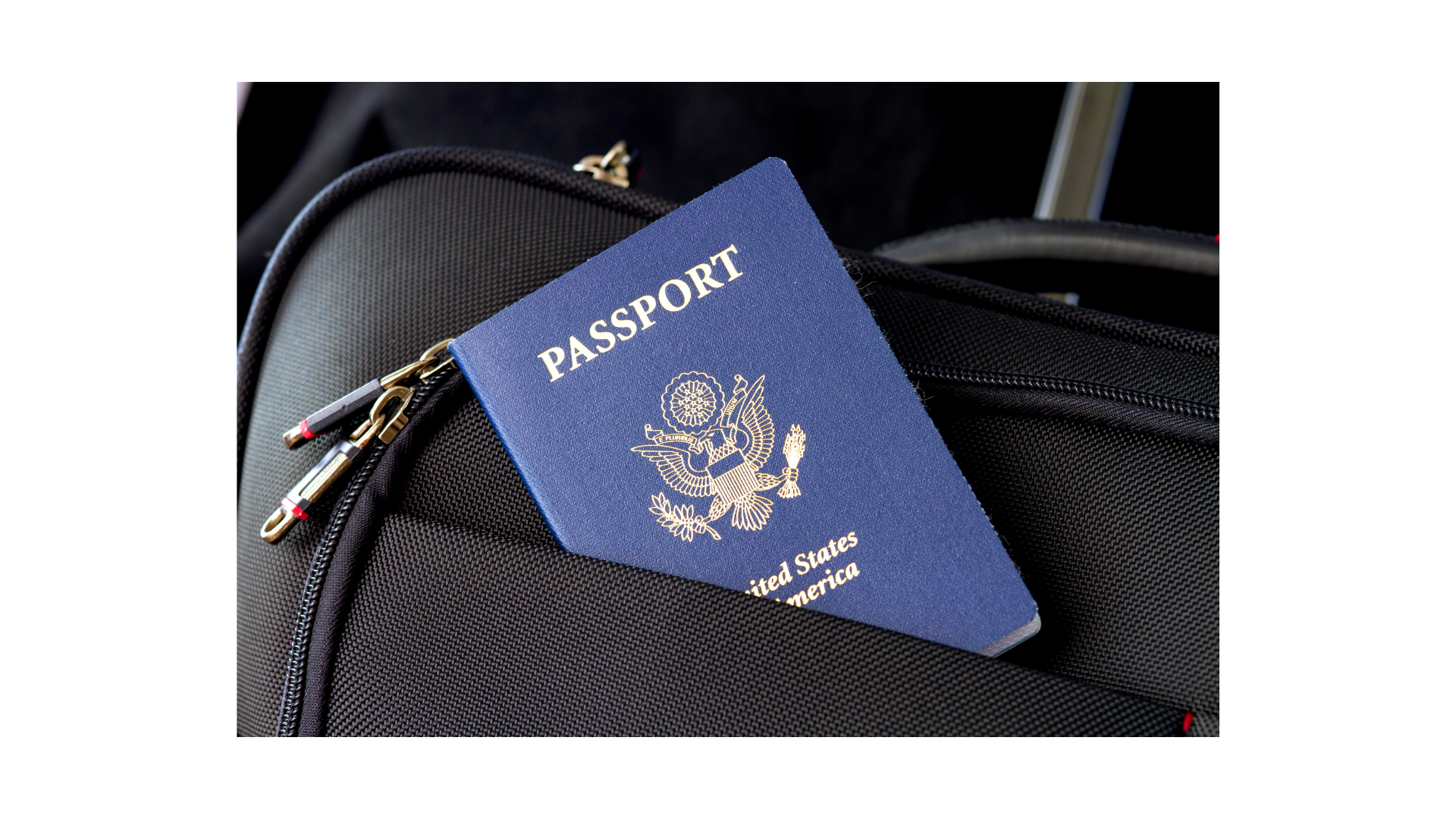 Blue passport book sticking out of a suitcase.  