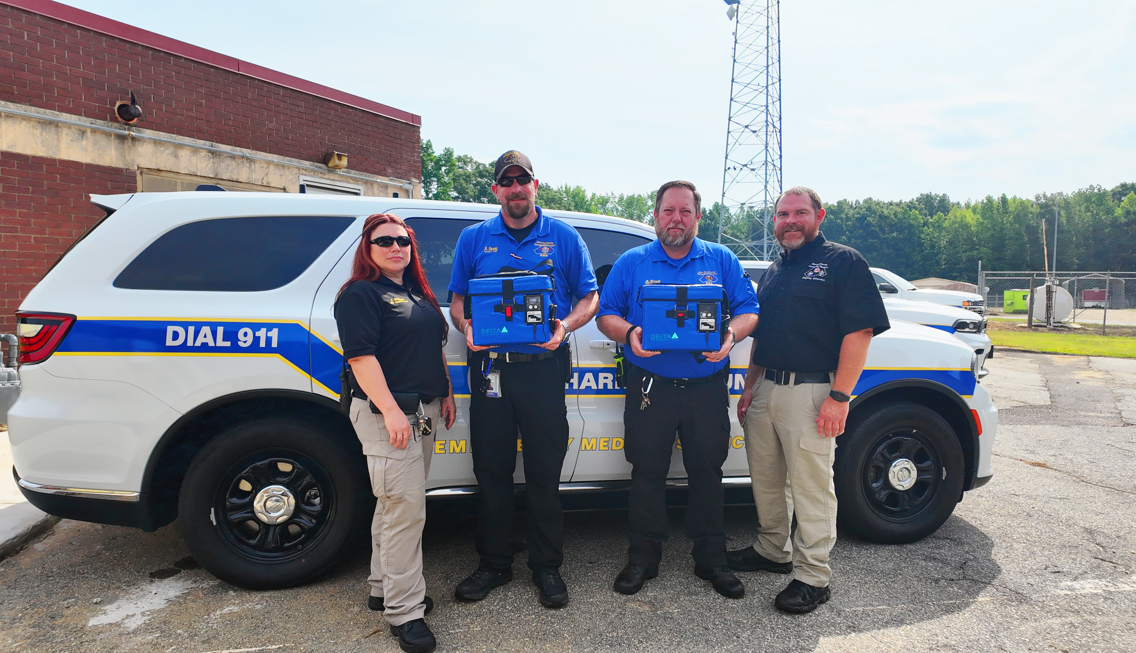 4 EMS Staff holding box
