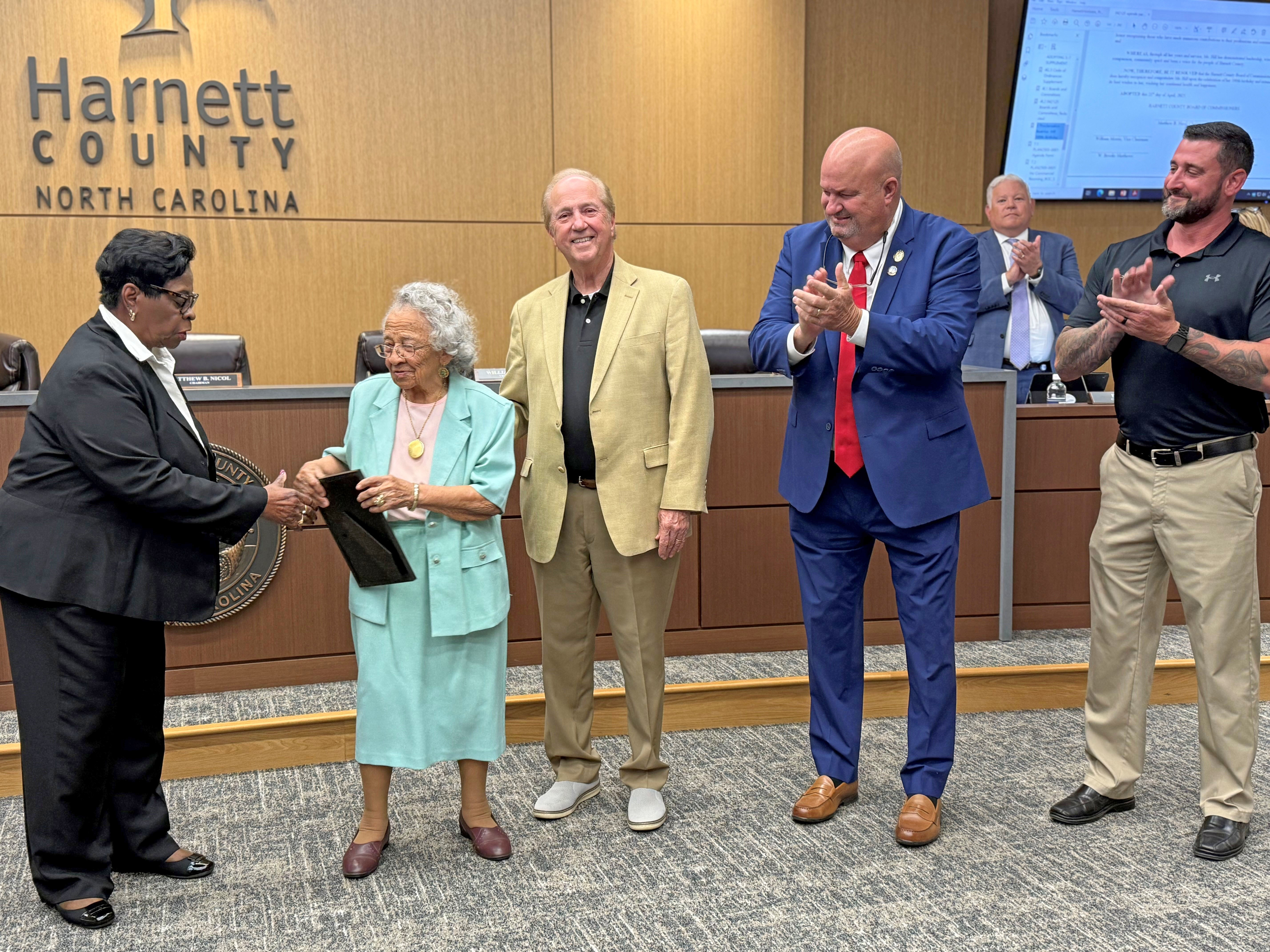 Board presenting Hill with proclamation